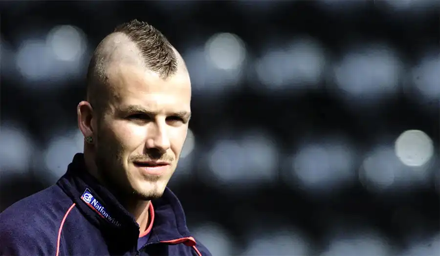 David Beckham with his iconic football hairstyles