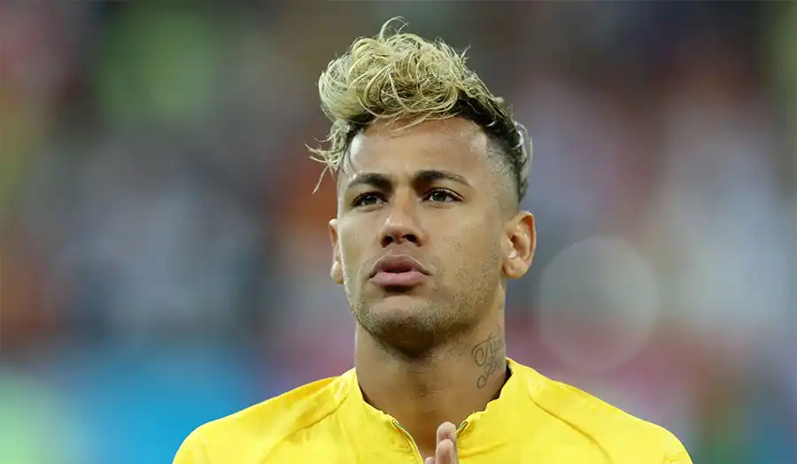 Neymar Jr. showing flashy hairstyle on the field