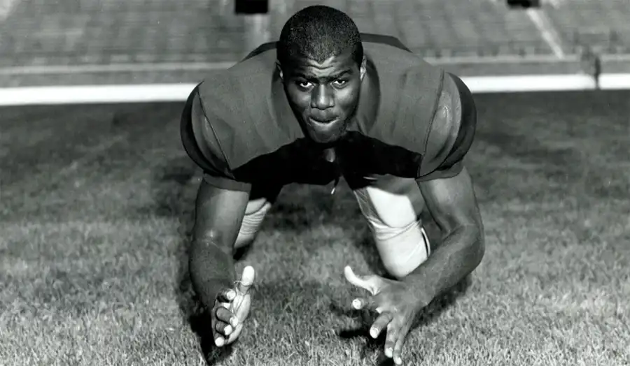 Alan Page in action for Notre Dame, showcasing his strength and intensity