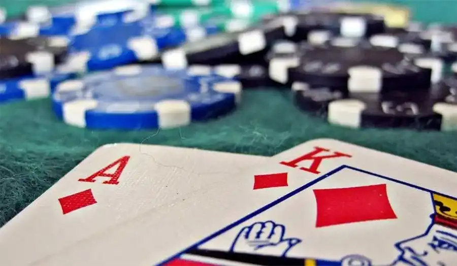 Blackjack player holding an Ace and a King representing a natural 21