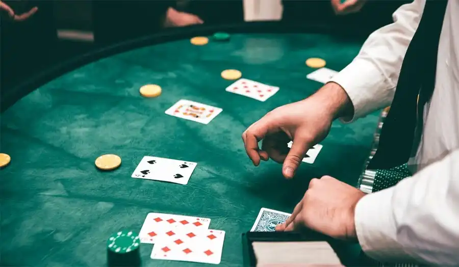 Dealer turning over final blackjack card