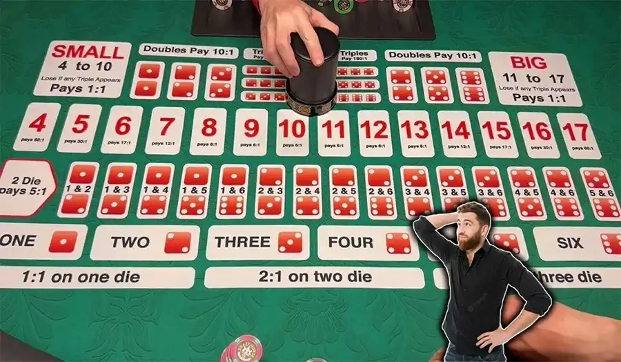 Player looking at sic bo betting options at a casino