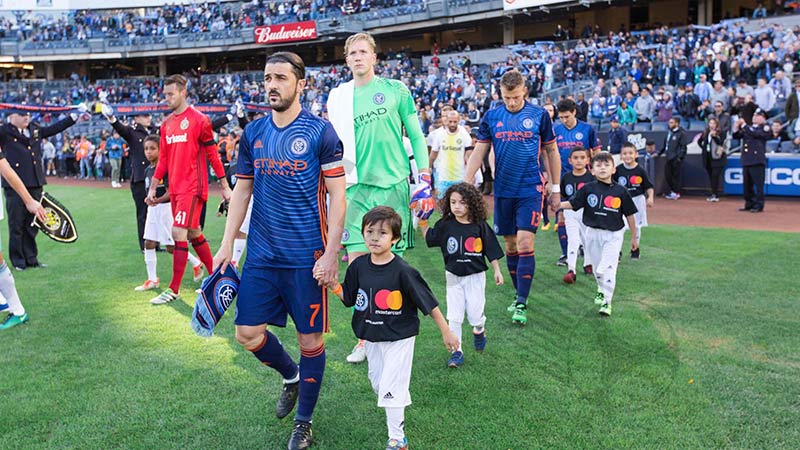 Why do soccer players walk out with kids: Growing into the norm