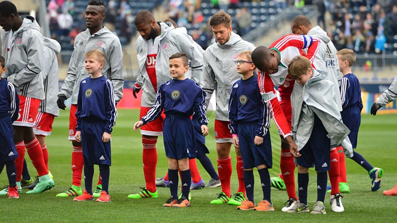 Many football clubs help young fans with serious illnesses by offering them the chance to become a player chaperone or team mascot.